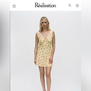 Realisation Par Isabelli in Verona yellow with floral dress in size S.